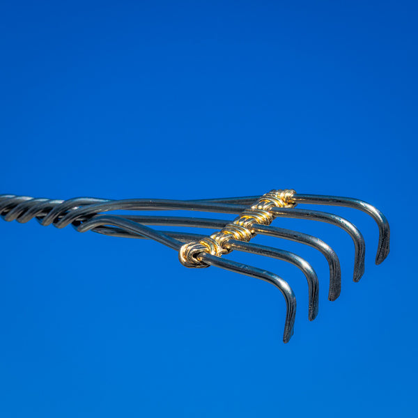 Heavy Duty Brass Knuckles is a metal back scratcher that will beat the toughest itch