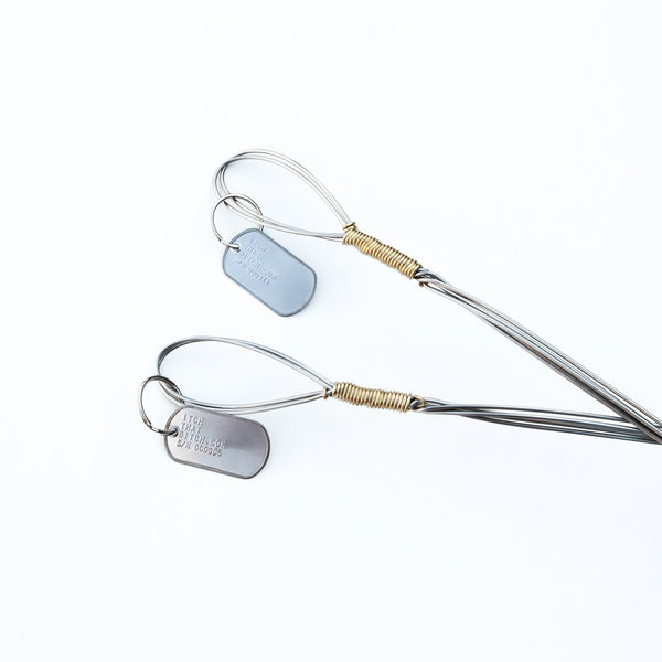 Handle detail of two Silver Fingers back scratchers
