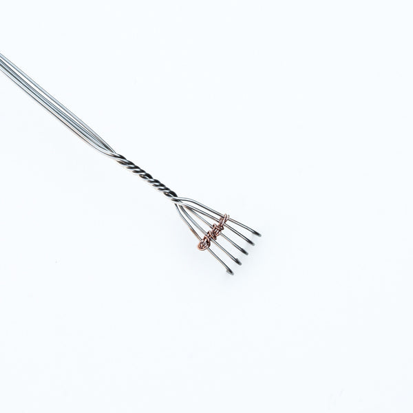 Head of Fingers back scratcher, copper trim on stainless steel body